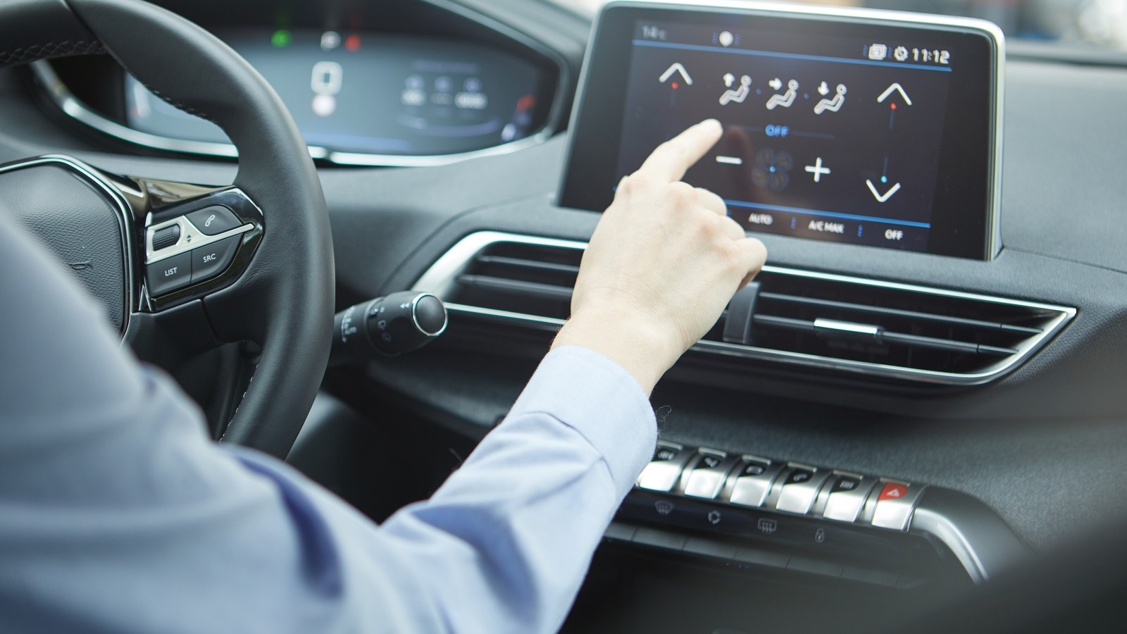 Car dashboard. Radio closeup. Woman sets up air conditioning